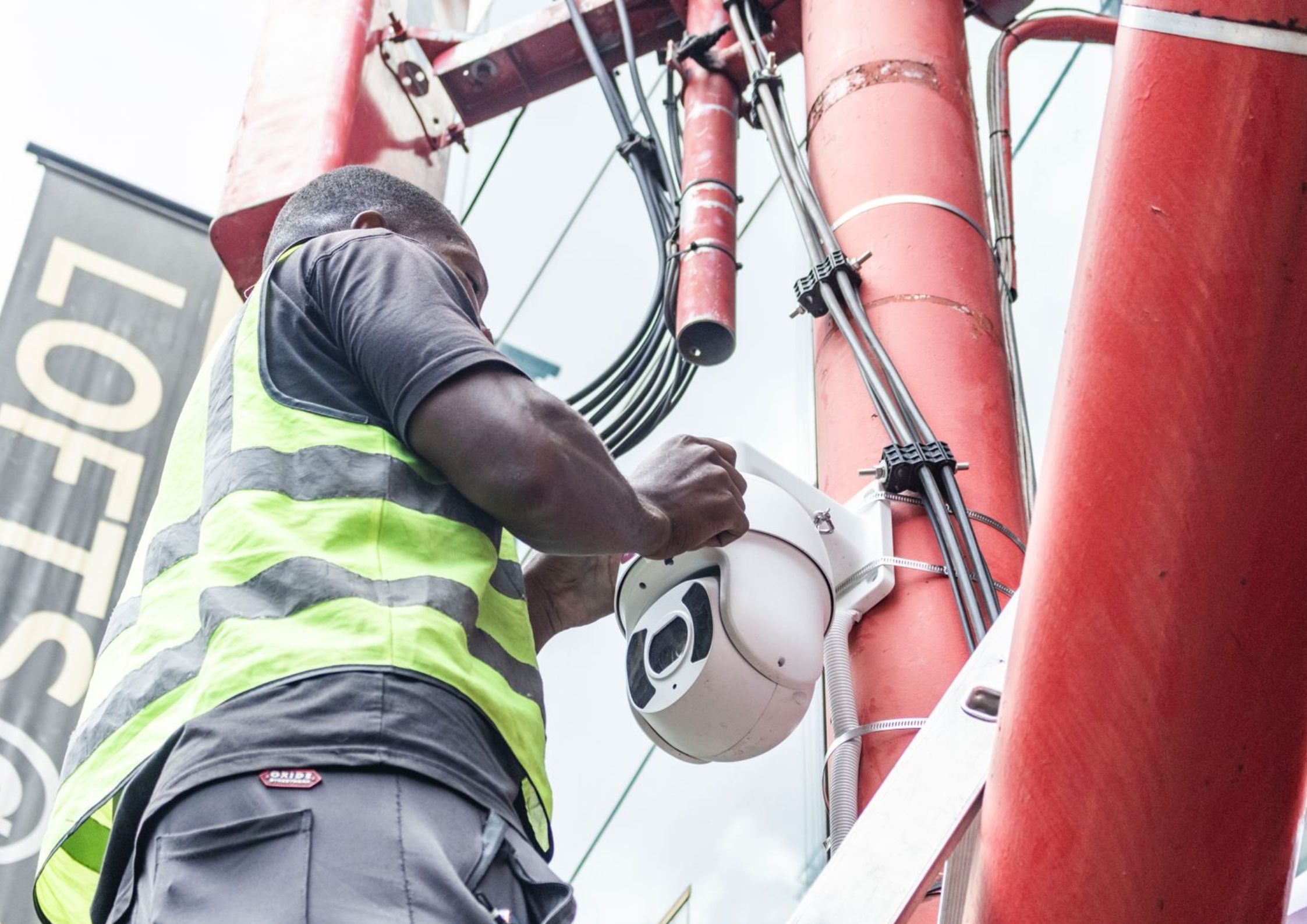 A Motshwanelo technician installing smart city surveillance infrastructure